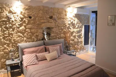 Letto o letti in una camera di Domu 600 - Suite mini appartamento Cagliari centro storico