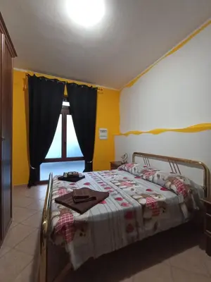Letto o letti in una camera di Casetta vacanze Gonnesa