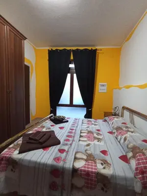 Letto o letti in una camera di Casetta vacanze Gonnesa