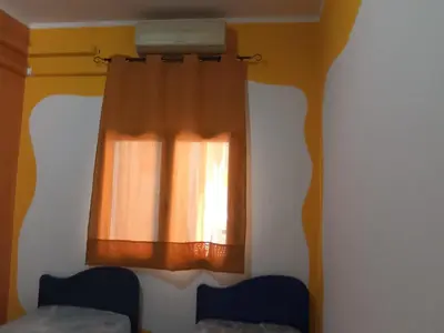 Letto o letti in una camera di Casetta vacanze Gonnesa