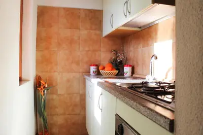 Cucina o angolo cottura di Terraced House in Costa Rei by the Sea