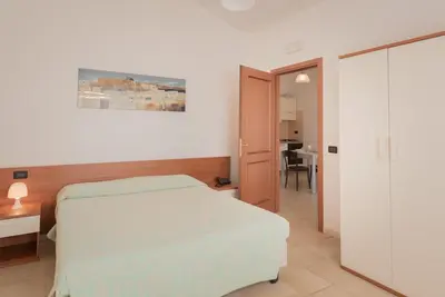 Letto o letti in una camera di Residence Le Fontane
