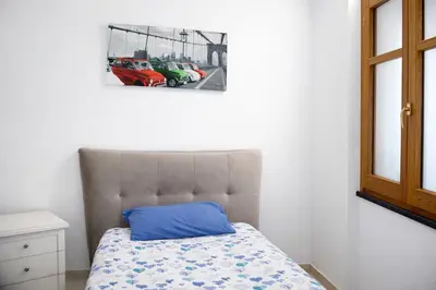 Letto o letti in una camera di Elegante appartamento in centro Pula - vicino alle spiaggie