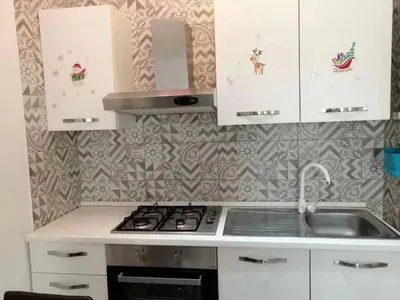Cucina o angolo cottura di Appartamento di fronte al porto turistico