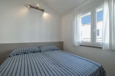 Letto o letti in una camera di Le Nacchere Dimore a portata di mare