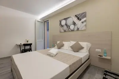 Letto o letti in una camera di DELEDDA HOME