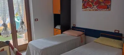 Letto o letti in una camera di Casa Lilla 1 e 2 casa indipendente con giardino
