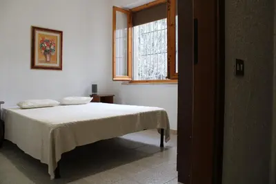 Letto o letti in una camera di Villa Luigina e Orazio,Cardedu, 7 posti letto