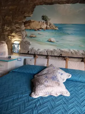 Letto o letti in una camera di B&B Martina