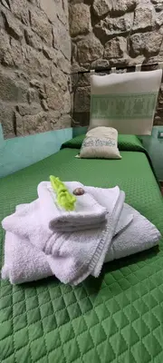 Letto o letti in una camera di B&B Martina