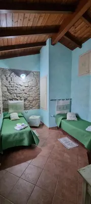 Letto o letti in una camera di B&B Martina