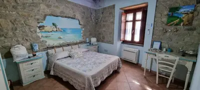 Letto o letti in una camera di B&B Martina