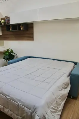 Letto o letti in una camera di Home Viale Trento 16