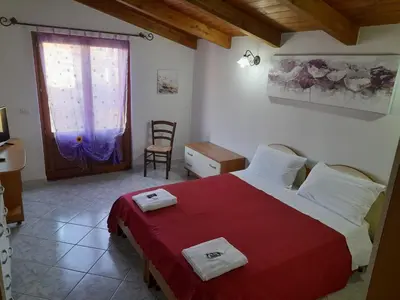 Letto o letti in una camera di B&B da Marianna