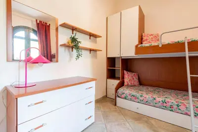 Letto o letti in una camera di La Casetta di Lia - vista mare Eden Rock