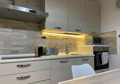 Cucina o angolo cottura di [Loft Comodo ed Elegante] • Wi-Fi e Colazione