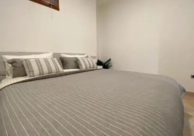 Letto o letti in una camera di [Loft Comodo ed Elegante] • Wi-Fi e Colazione