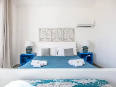 Letto o letti in una camera di Villa Virago
