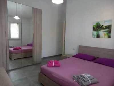Letto o letti in una camera di Casa Beranu