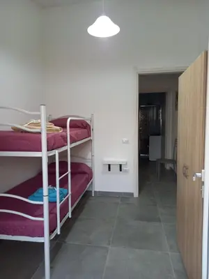 Letto o letti in una camera di Casa Beranu