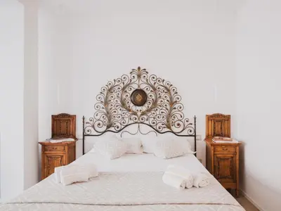 Letto o letti in una camera di Suite il cielo in pieno centro storico in Cagliari