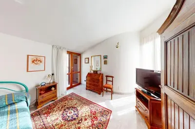 Letto o letti in una camera di Villa con piscina e giardino a due passi dal mare.