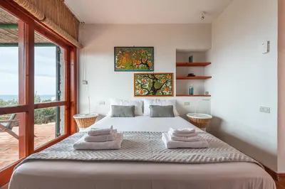 Letto o letti in una camera di Pedra - Seaside & pool villa in wild Mediterranean