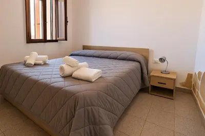Letto o letti in una camera di Casa vacanze Sardegna, Torre dei Corsari Costa Verde