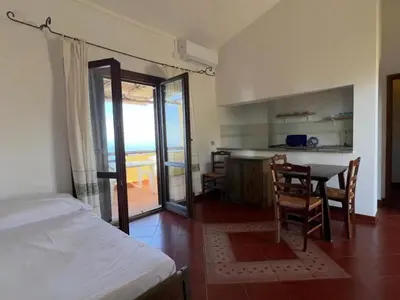 Letto o letti in una camera di Torre delle Stelle Residence Aura Club