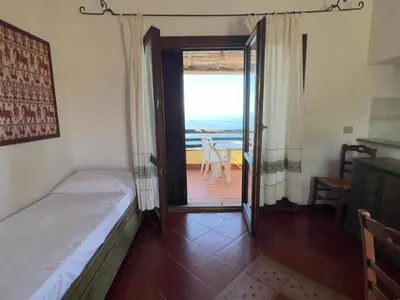 Letto o letti in una camera di Torre delle Stelle Residence Aura Club