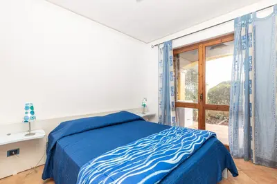Letto o letti in una camera di Casa il grande Carrubo