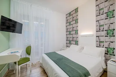 Letto o letti in una camera di DIMORE IN residenze asproni 24