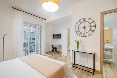 Letto o letti in una camera di DIMORE IN residenze asproni 24