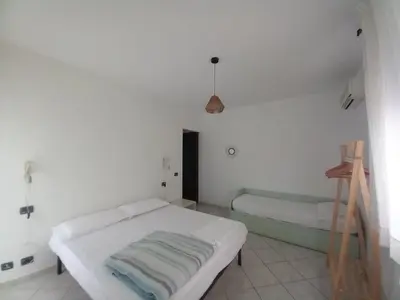 Letto o letti in una camera di Villa Acquamarina