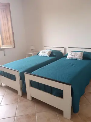Letto o letti in una camera di Tana della Volpe