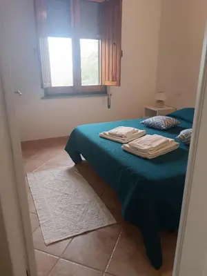 Letto o letti in una camera di Tana della Volpe