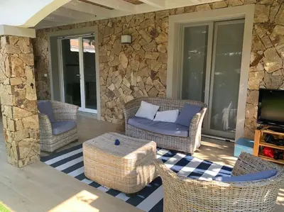 Area soggiorno di Residence Elegance Villa La Sterlizia Porto Pino