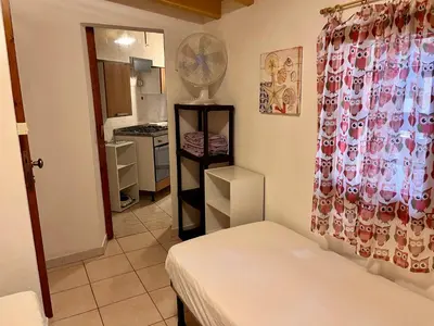 Letto o letti in una camera di Rustico Porto Pino 30 mt dalla spiaggia