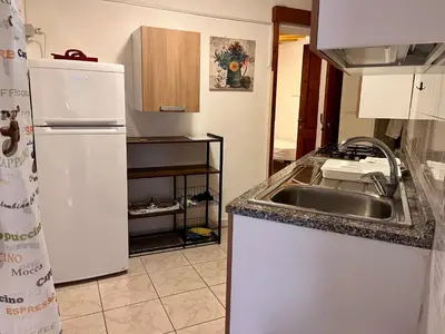 Cucina o angolo cottura di Rustico Porto Pino 30 mt dalla spiaggia