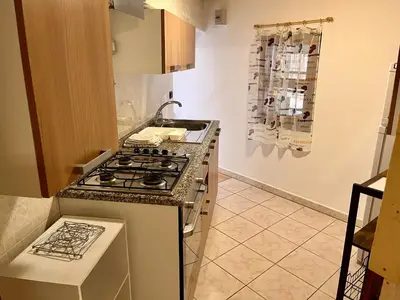 Cucina o angolo cottura di Rustico Porto Pino 30 mt dalla spiaggia