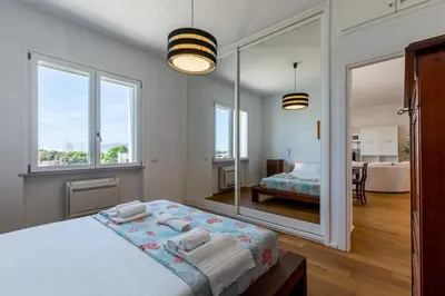 Letto o letti in una camera di Sunichele Luxury Apartment