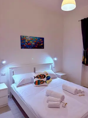 Letto o letti in una camera di Villetta indipendente Simius