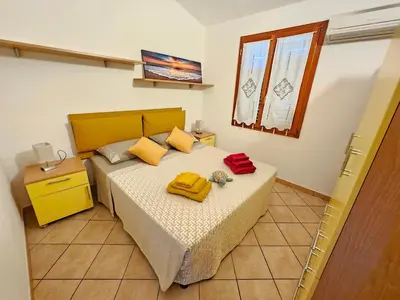 Letto o letti in una camera di Sun & Beach house Costa Rei
