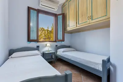 Letto o letti in una camera di Villa Favola indipendente con piscina