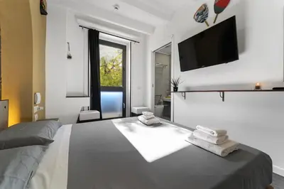 Letto o letti in una camera di Ukiyo Suites And Rooms