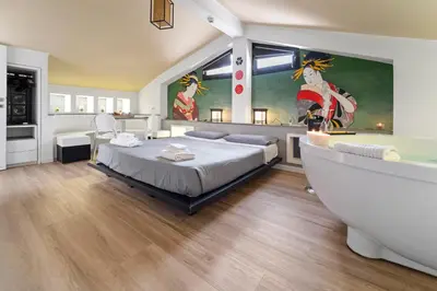 Letto o letti in una camera di Ukiyo Suites And Rooms