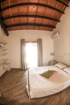 Letto o letti in una camera di Domu Virginia
