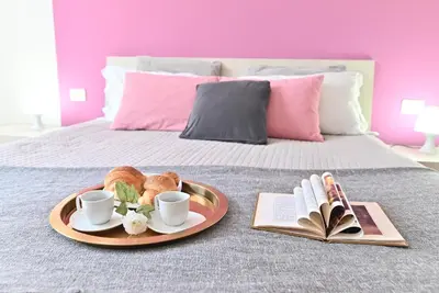 Letto o letti in una camera di IzzHome Njoy