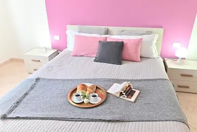 Letto o letti in una camera di IzzHome Njoy