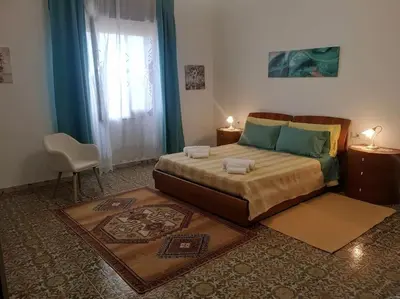 Letto o letti in una camera di L'oasi di Angela2 (I.U.N. Q5074)